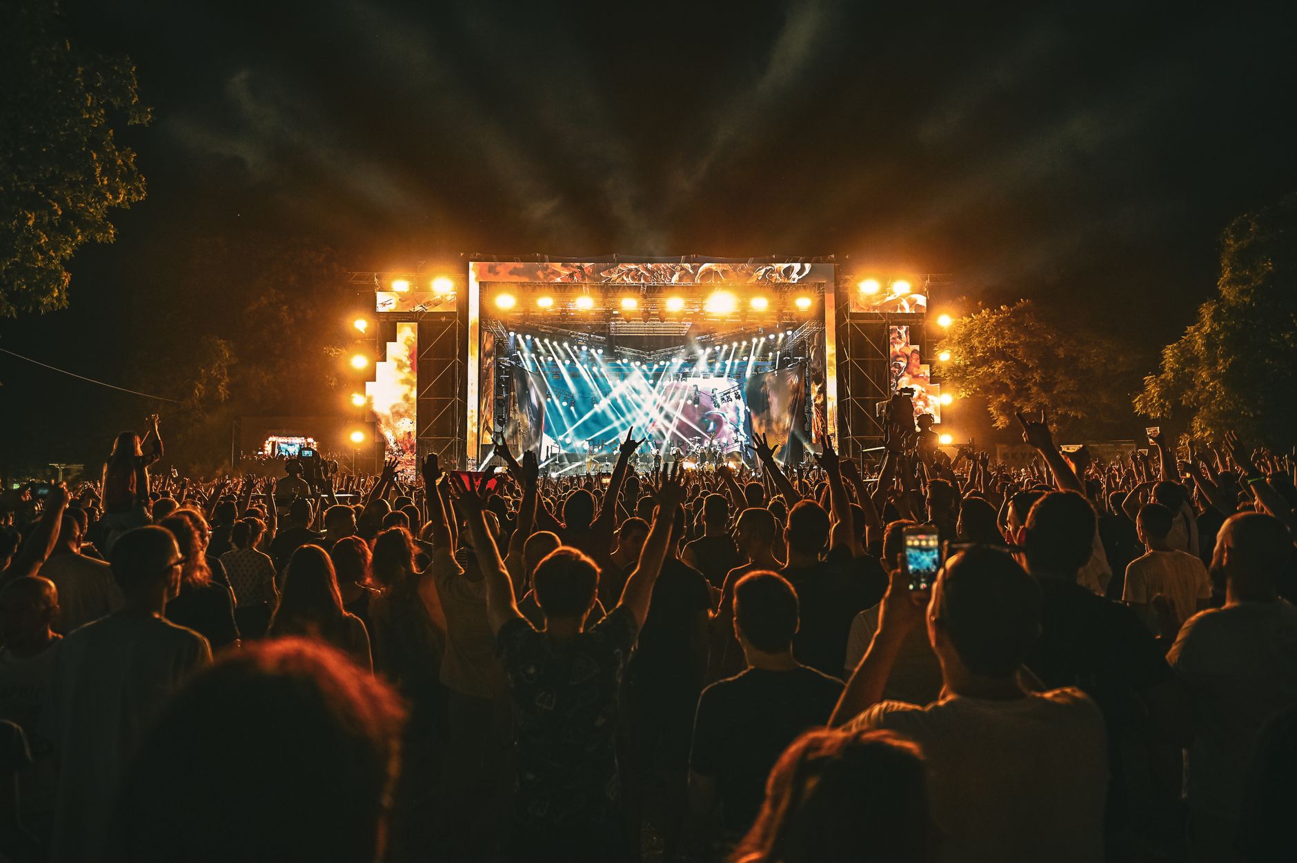 Metal festival crowd at night, capturing the energy of UK metal festivals 2026 beyond Download