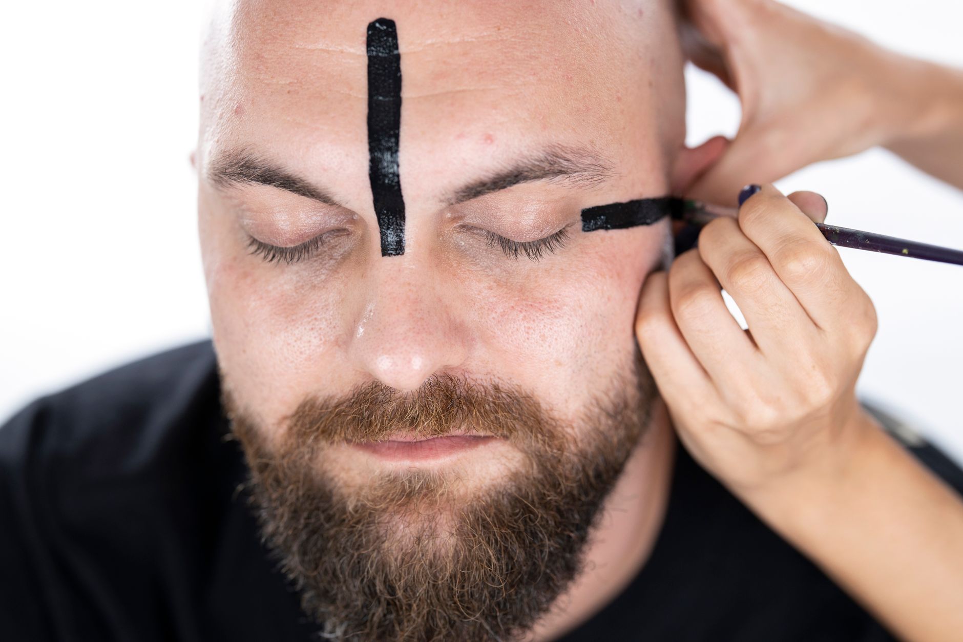 Close-up of black metal corpse paint used as anti-surveillance fashion in dark subculture